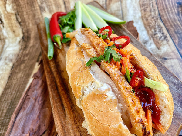 Close Up Shot of Banh Mi with crispy pork belly (Vietnamese Sandwich Baguette)