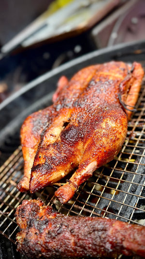Roasted chicken on a grill with a blurred background